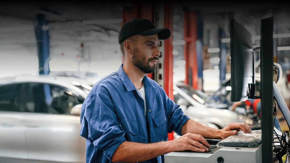Auto mechanic working in garage