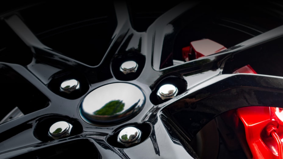 Modern light alloy wheel with red brake cylinder visible behind the rim